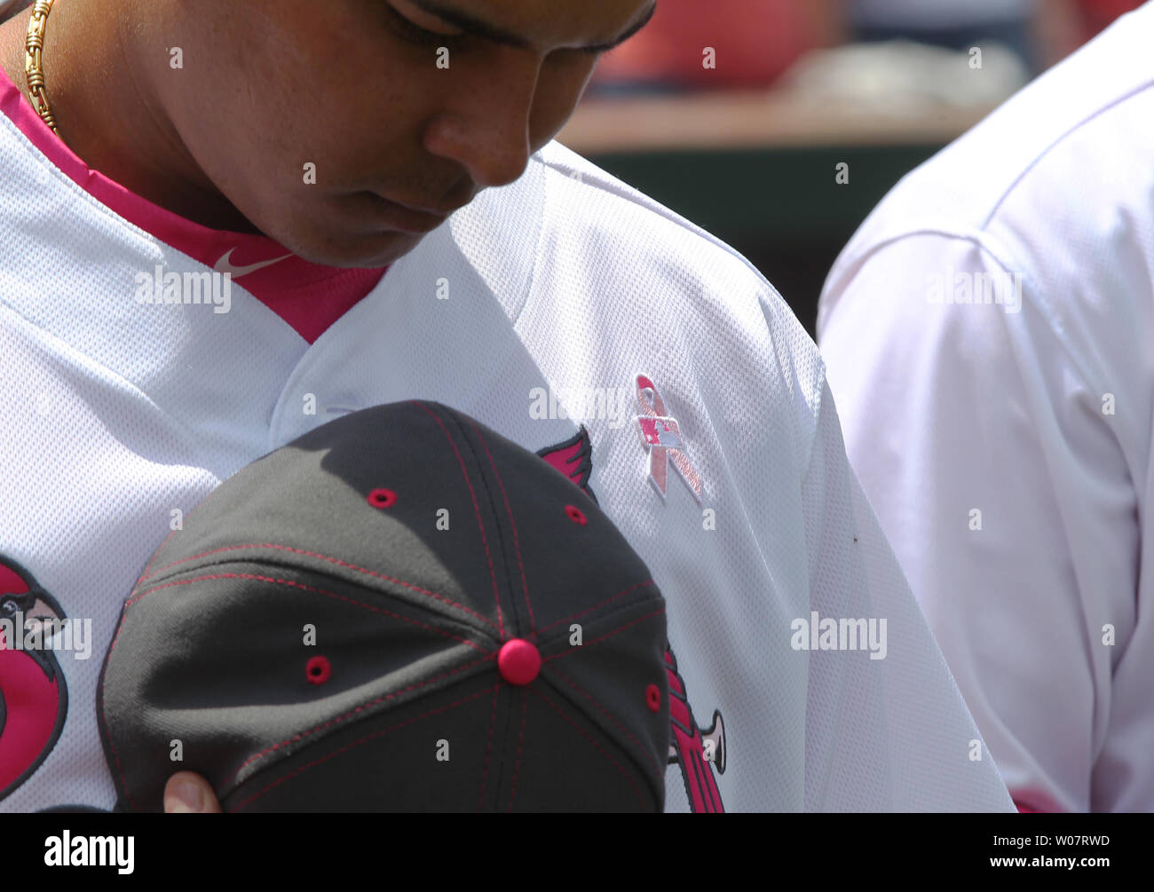 St. Louis Cardinals Ruben Tejada wears a pink ribbon on his uniform as he stands for the National Anthem before a game against the Pittsburgh Pirates as the Major Leagues celebrate Mothers Day with pink at Busch Stadium in St. Louis on May 7, 2016.    Photo by Bill Greenblatt/UPI Stock Photo