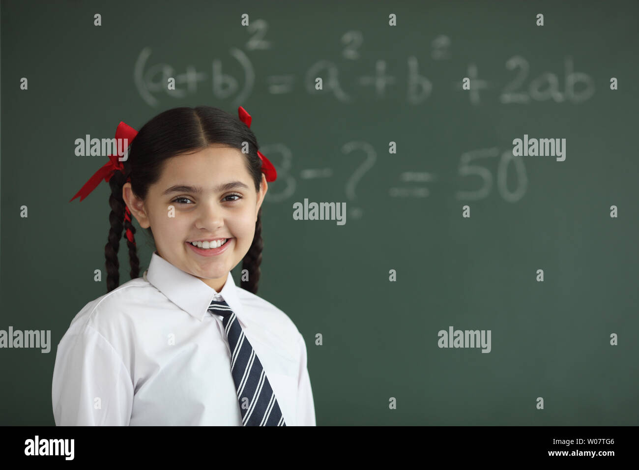 Portrait of a schoolgirl smiling Stock Photo - Alamy