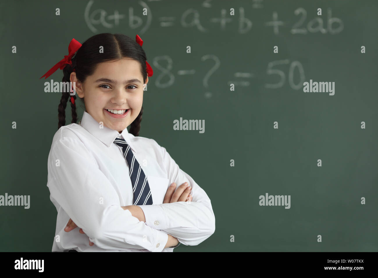 Portrait of a schoolgirl smiling Stock Photo - Alamy