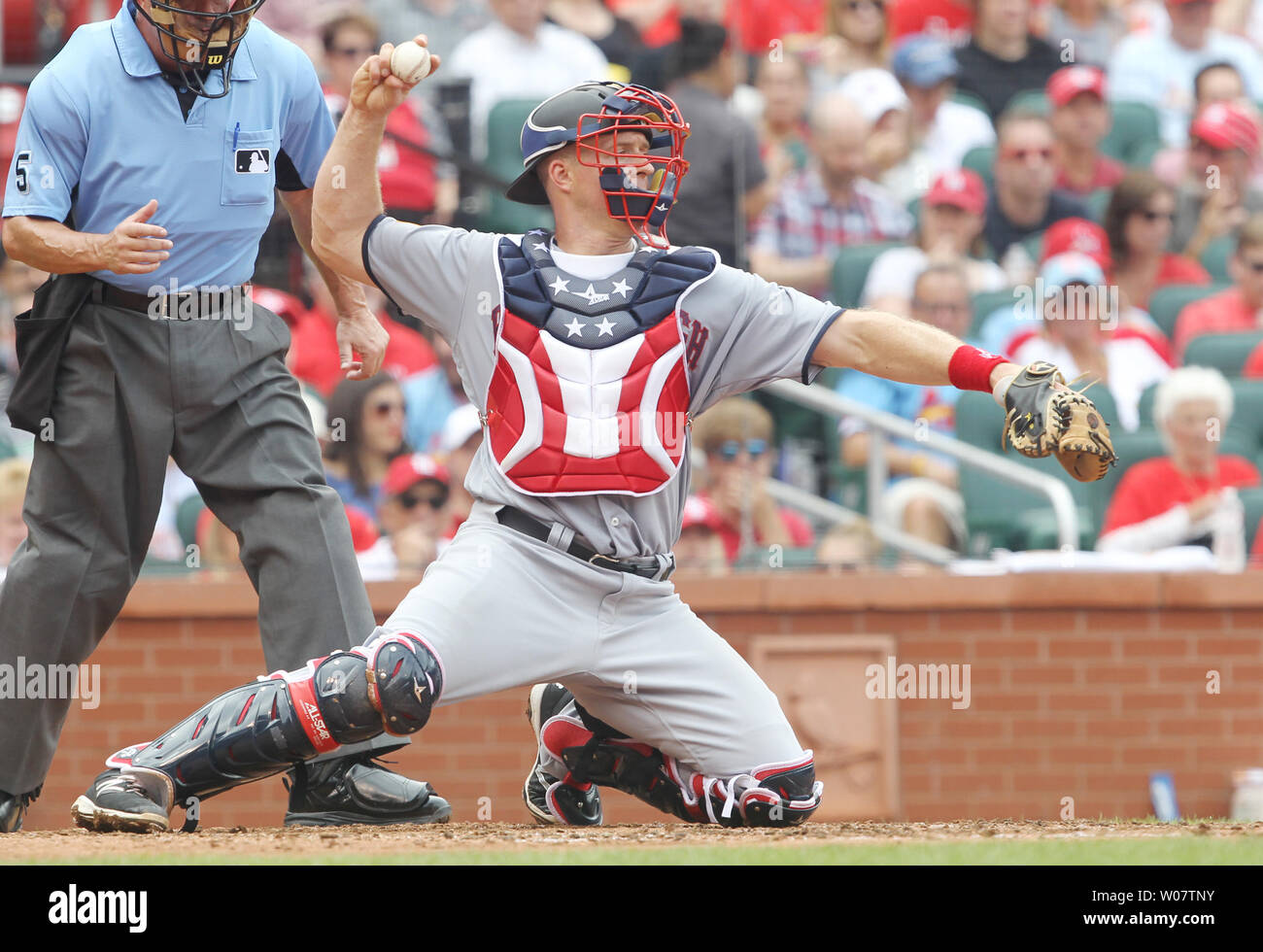 San Diego Padres Shawn Kelley throws the baseball during batting practice  while wearing red, white and blue socks before a ame against the St. Louis  Cardinals at Busch Stadium in St. Louis