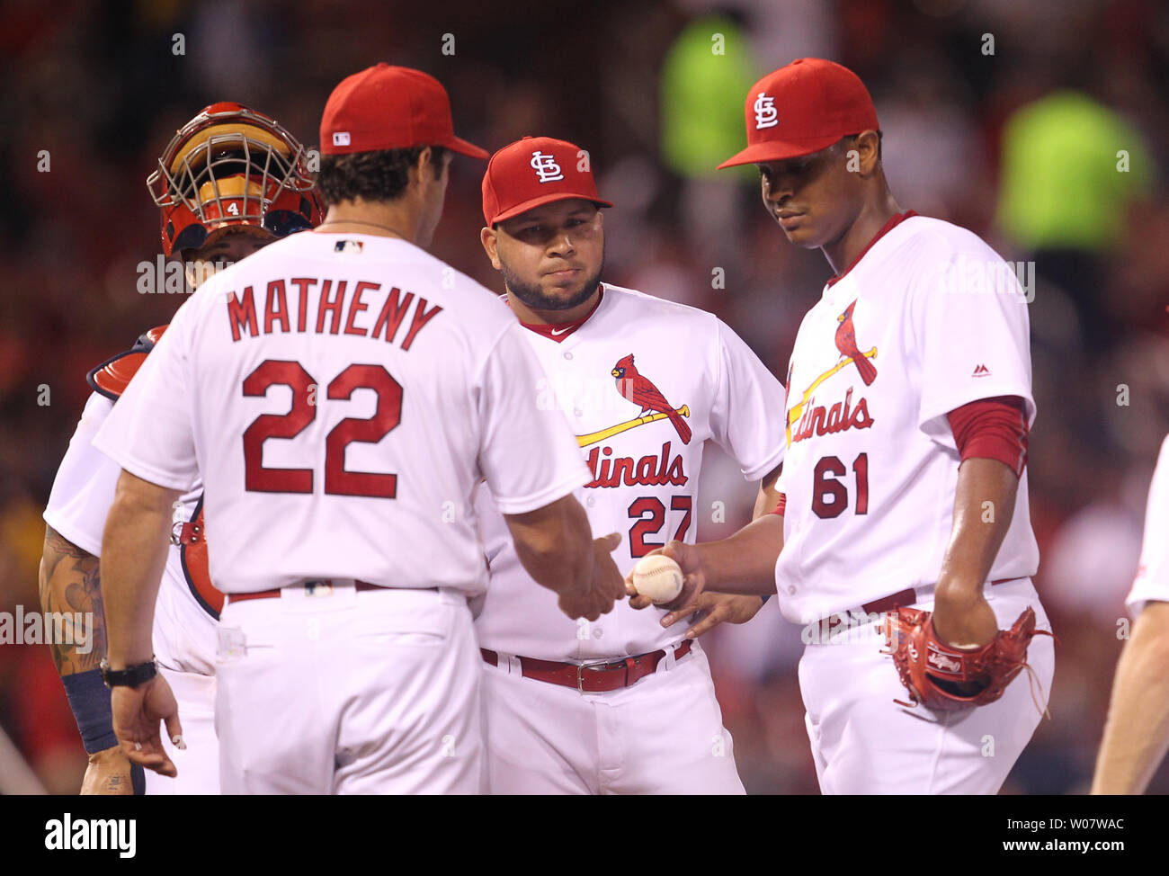 St. Louis Cardinals pitcher Alex Reyes hands the baseball off to manager Mike Matheny as he leaves the game in the seventh inning against the New York Mets at Busch Stadium in St. Louis on August 23, 2016.    Photo by Bill Greenblatt/UPI Stock Photo