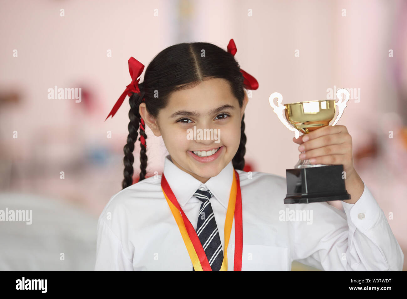 Happy school girl with medal and award hi-res stock photography and ...