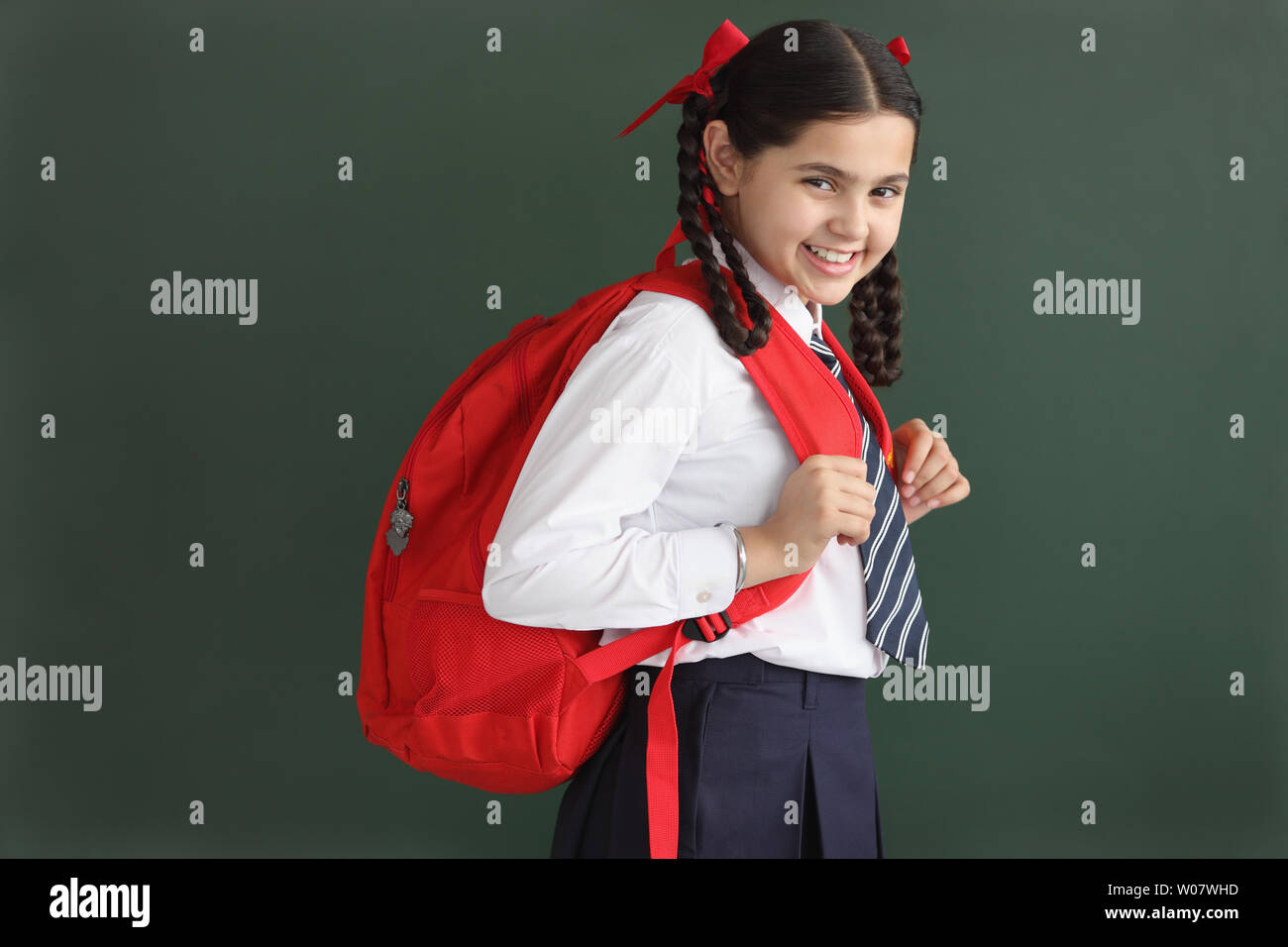 Portrait of a schoolgirl smiling Stock Photo - Alamy