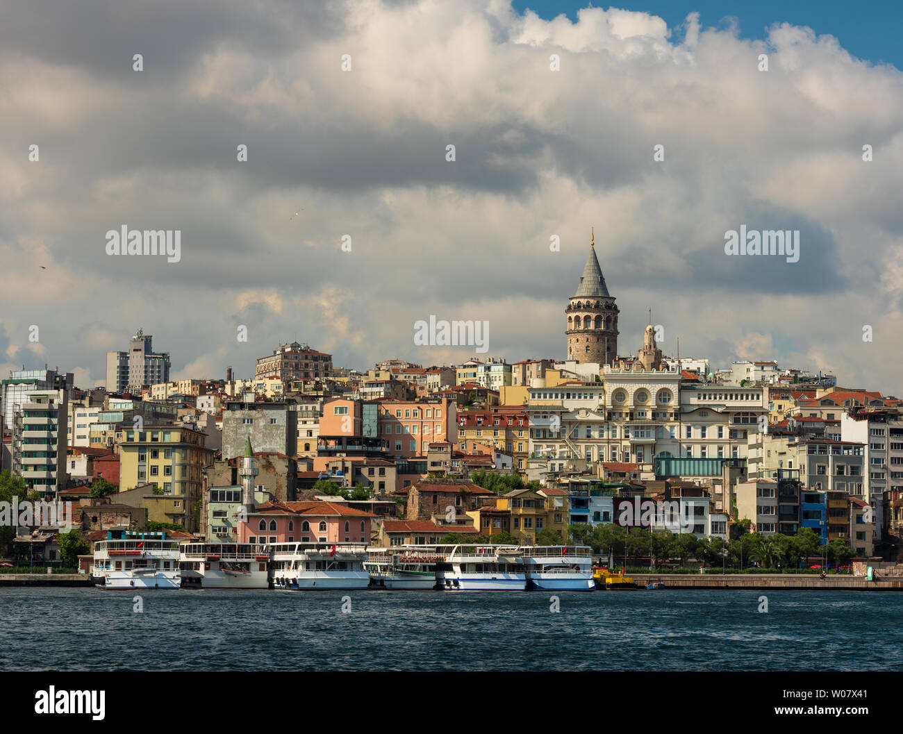 Beyoglu district old houses with Galata tower on top, view from the Golden Horn. June 26, 2019, Istanbul, Turkey Stock Photo