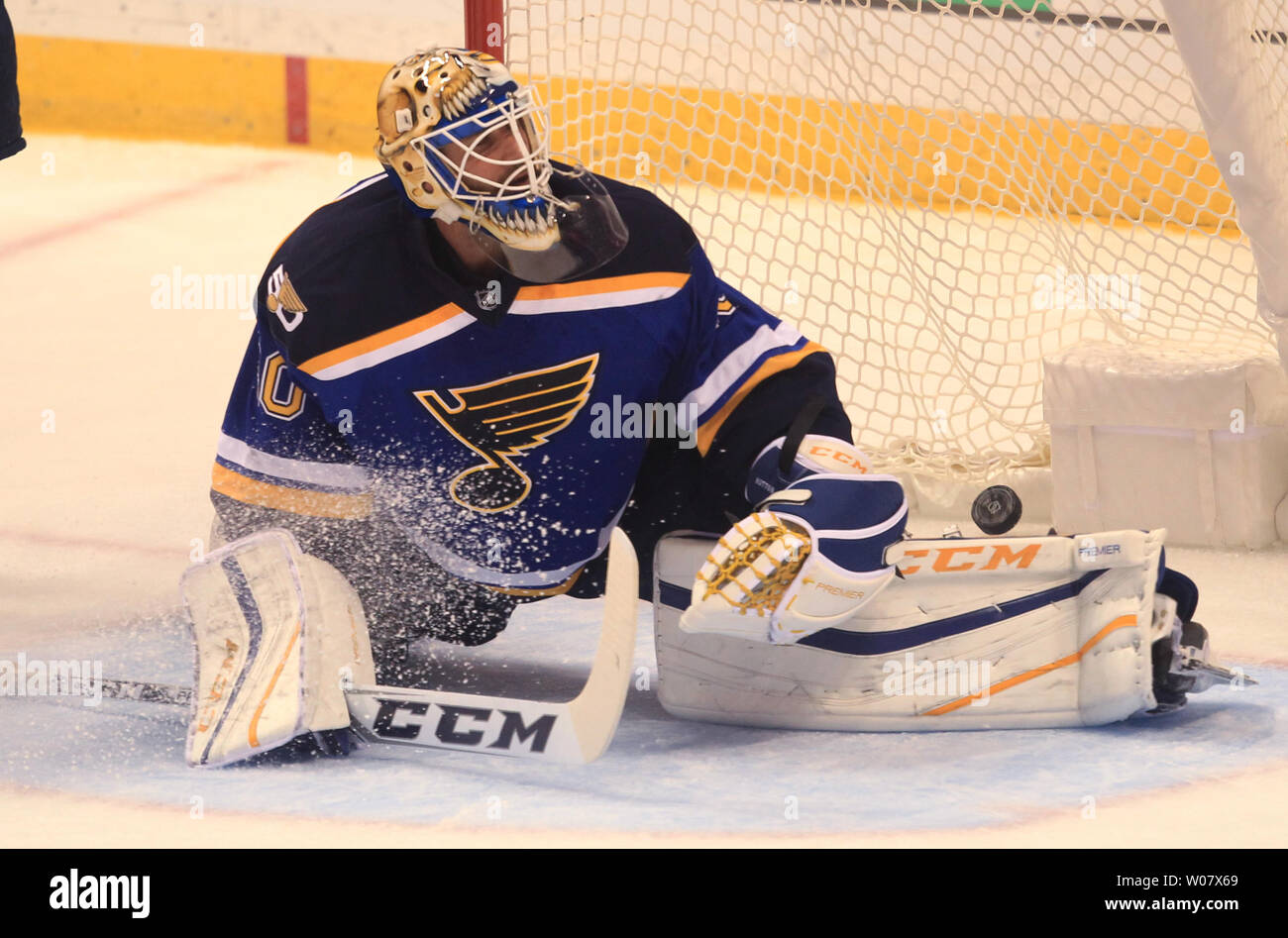 St. Louis Blues goaltender Carter Hutton can only watch as a puck off ...