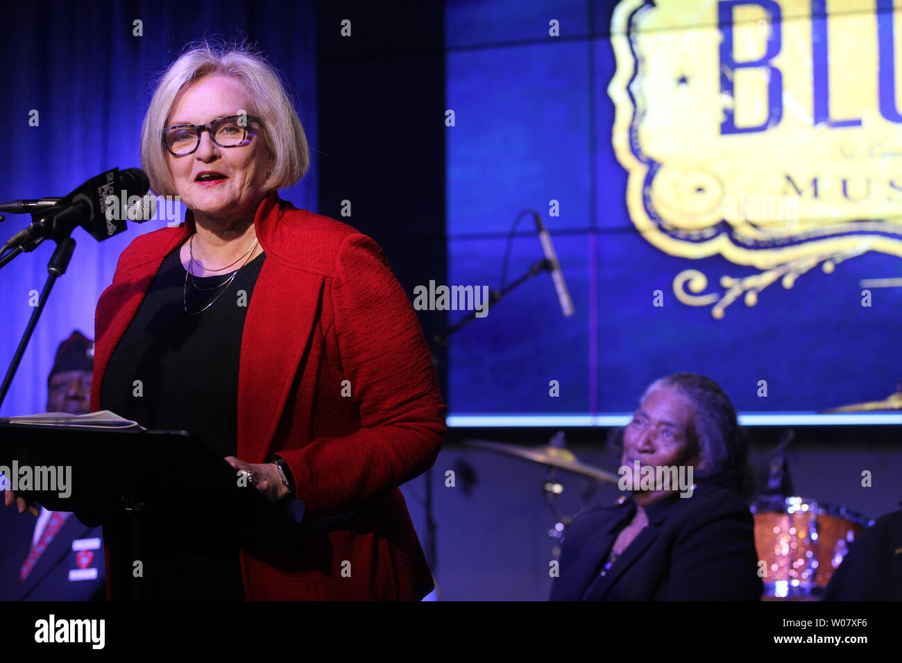Frances Johnson, widow of the late jazz and blues pianist Johnnie Johnson, listens as U.S. Senator Claire McCaskill makes her remarks before awarding Johnson the Congressional Gold Medal, at the National Blues Museum in St. Louis on November 28, 2016. Johnson, who lived in St. Louis, was a Montford Point Marine, the African-American Marines unit who endured racism and inspired social change while integrating the previously all-white Marine Corps during World War II. After his service, Johnson had a long musical career culminating with an induction into the Rock and Roll Hall of Fame. Photo by Stock Photo