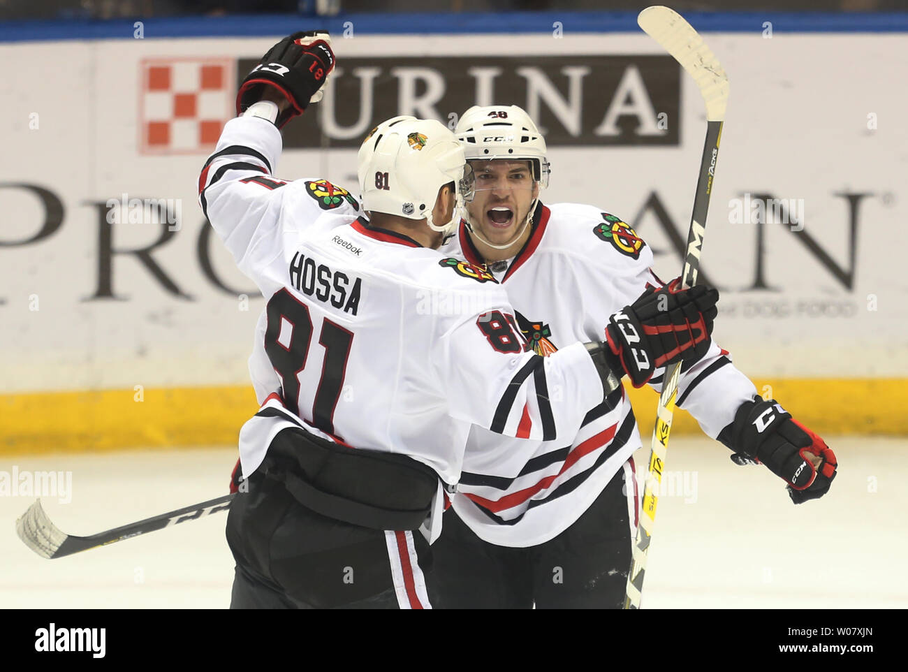 Chicago Blackhawks Vinnie Hinostroza is congratulated by teammate Marian Hossa after scoring what proved to be the winning goal against the St. Louis Blues in the third period at the Scottrade Center in St. Louis on December 17, 2016. Chicago defeated St. Louis 6-4. Photo by Bill Greenblatt/UPI Stock Photo