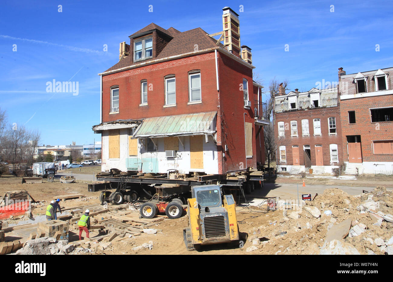 A construction company begins moving the house of Charlsetta Taylor out of  an area that will be used to construct the new National  Geospatial-Intelligence Agency (NGA) in St. Louis on February 15
