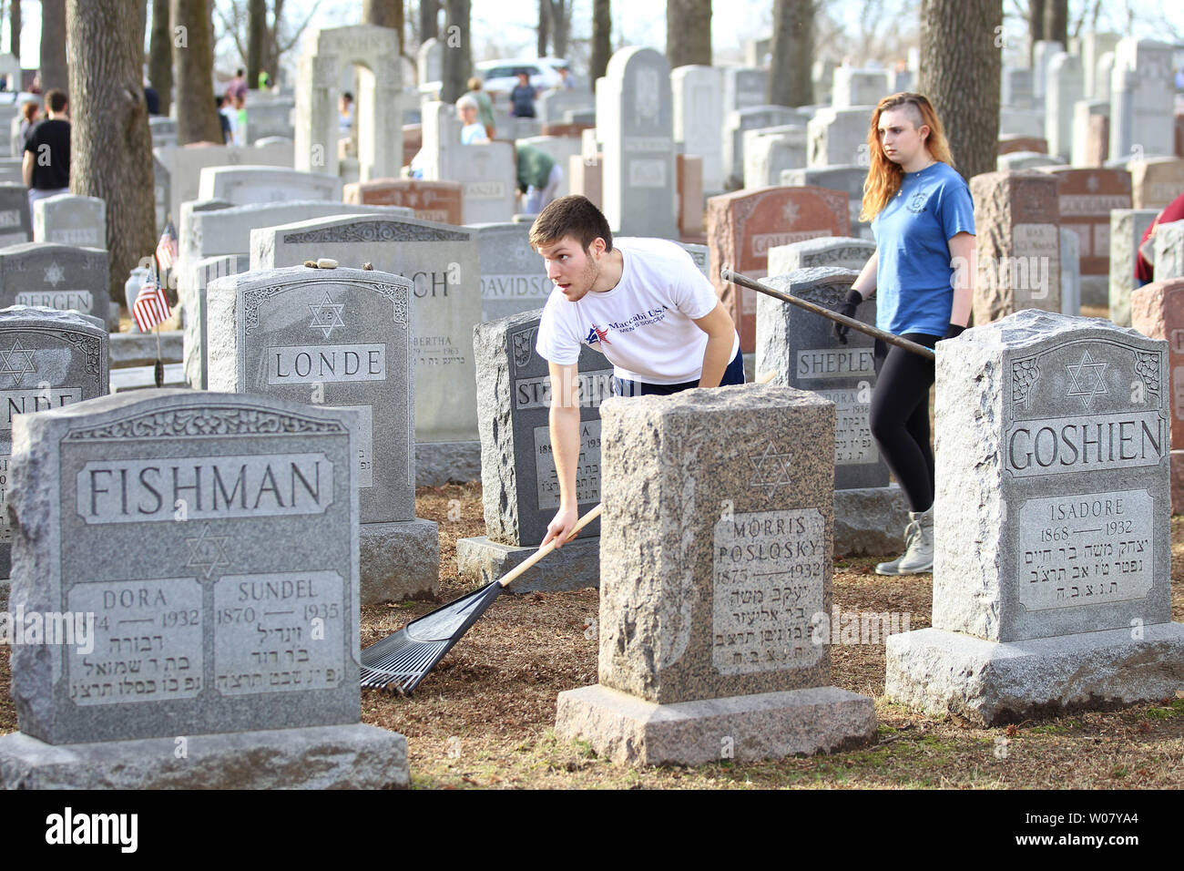 Volunteers rake up old leaves at Chesed Shel Emeth Cemetery in University City, Missouri on February 22, 2017. Vandals toppled nearly 200 headstones on February 20, 2017 prompting the community cleanup effort that attracted over four thousand people.  Photo by Bill Greenblatt/UPI Stock Photo