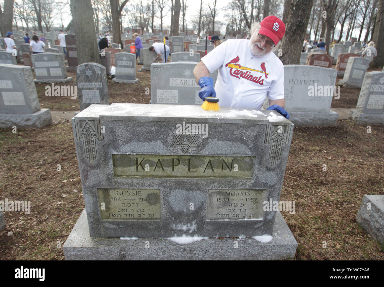 Dr. Steve Brown uses a brush and soap to clean a headstone at Chesed Shel Emeth Cemetery in University City, Missouri on February 22, 2017. Vandals toppled nearly 200 headstones on February 20, 2017 in the Jewish cemetery. A large community cleanup effort  attracted over four thousand people.  Photo by Bill Greenblatt/UPI Stock Photo