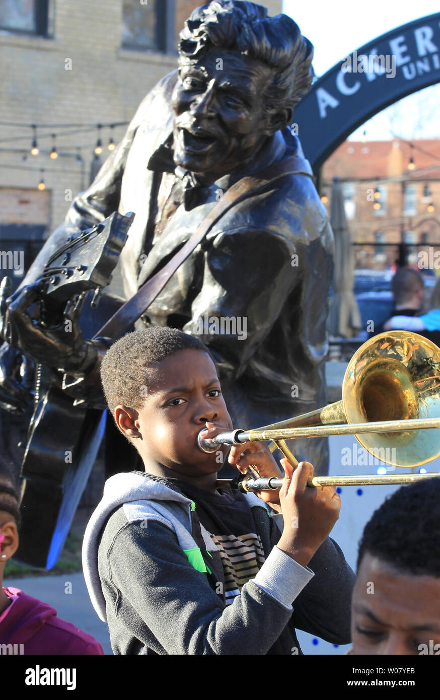 Daniel Anderson (11) plays the trombone in the Baily Sounds of Holiness Gospil Band, near the statue of rock and roll founder Chuck Berry in the Loop in University City, Missouri on March 18, 2017. Berry died at his home in St. Charles County Missouri on March 18, 2017 at the age of 90. Photo by Bill Greenblatt/UPI Stock Photo