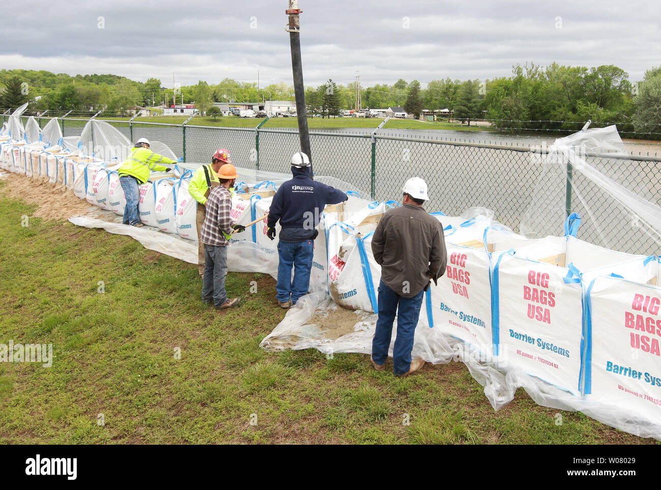 Employees at Metropolitian Sewer District fill sand bags with material as the nearby Meramec River keeps getting closer in Fenton, Missouri on May 1, 2017. In 2015 the Meramec River inundated the plant, closing it for two weeks for repairs. Flood waters from rivers across the state of Missouri are forcing officials to close roads and people to move.  So far 350 roads have closed. Photo by Bill Greenblatt/UPI Stock Photo