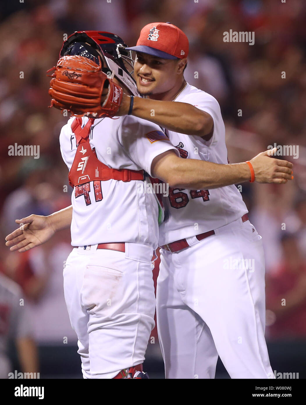 St. Louis Cardinals pitcher Sam Tuivailala and catcher Eric Fryer celebrate  the third out and a 14-6 win over the Miami Marlins at Busch Stadum in St.  Louis on July 3, 2017.