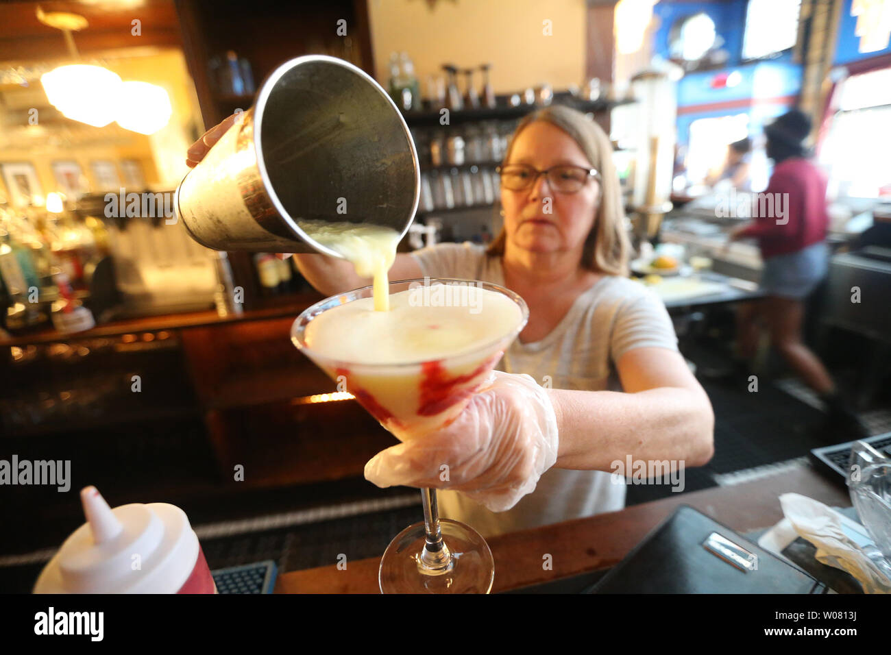 Barbara Schulz, General Manager of the Fountain on Locust, pours a rasberry lemondrop ice cream martini on National Ice Cream Day in St. Louis on July 16, 2017. Photo by Bill Greenblatt/UPI Stock Photo