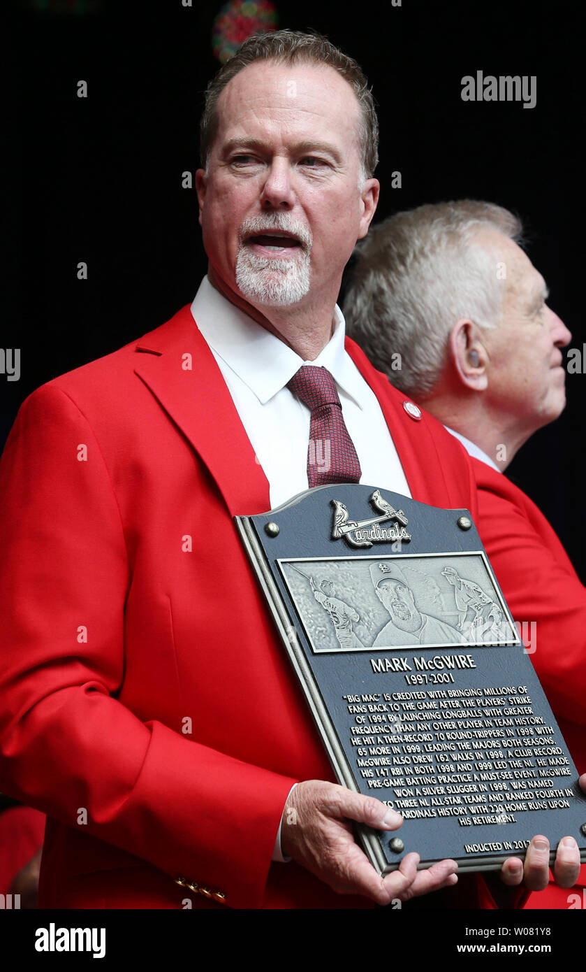 Newly inducted St. Louis Cardinals Hall of Fame member Mark McGwire holds his placque following the St. Louis Cardinals Hall of Fame Induction ceremonies in St. Louis on August 26, 2017. McGwire played 4 1/2 years with the Cardinals breaking Roger Maris' home run record, hitting 70 home runs in 1998 and is now the bench coach for the San Diego Padres.       Photo by Bill Greenblatt/UPI Stock Photo