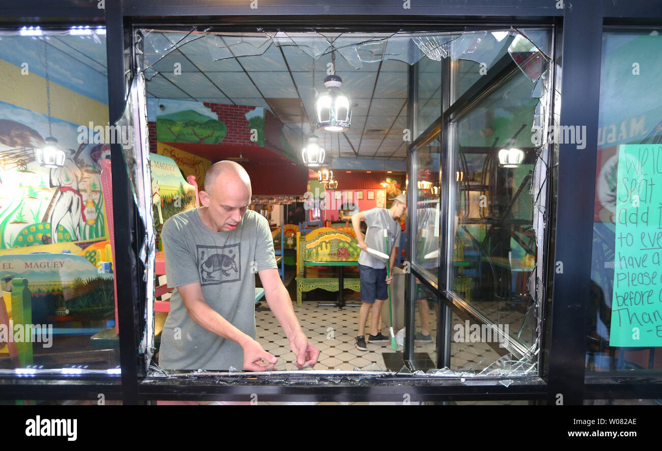Volunteers Help Store Owners Clean Up Broken Glass From Their Store Fronts In University City Missouri On September 17 17 After Overnight Protests Turned Violent A Non Guilty Verdict Of A Former White Volunteers Help Store Owners Clean Up Broken Glass From Their Store Fronts In University City Missouri On September 17 17 After Overnight Protests Turned Violent A Non Guilty Verdict Of A Former White