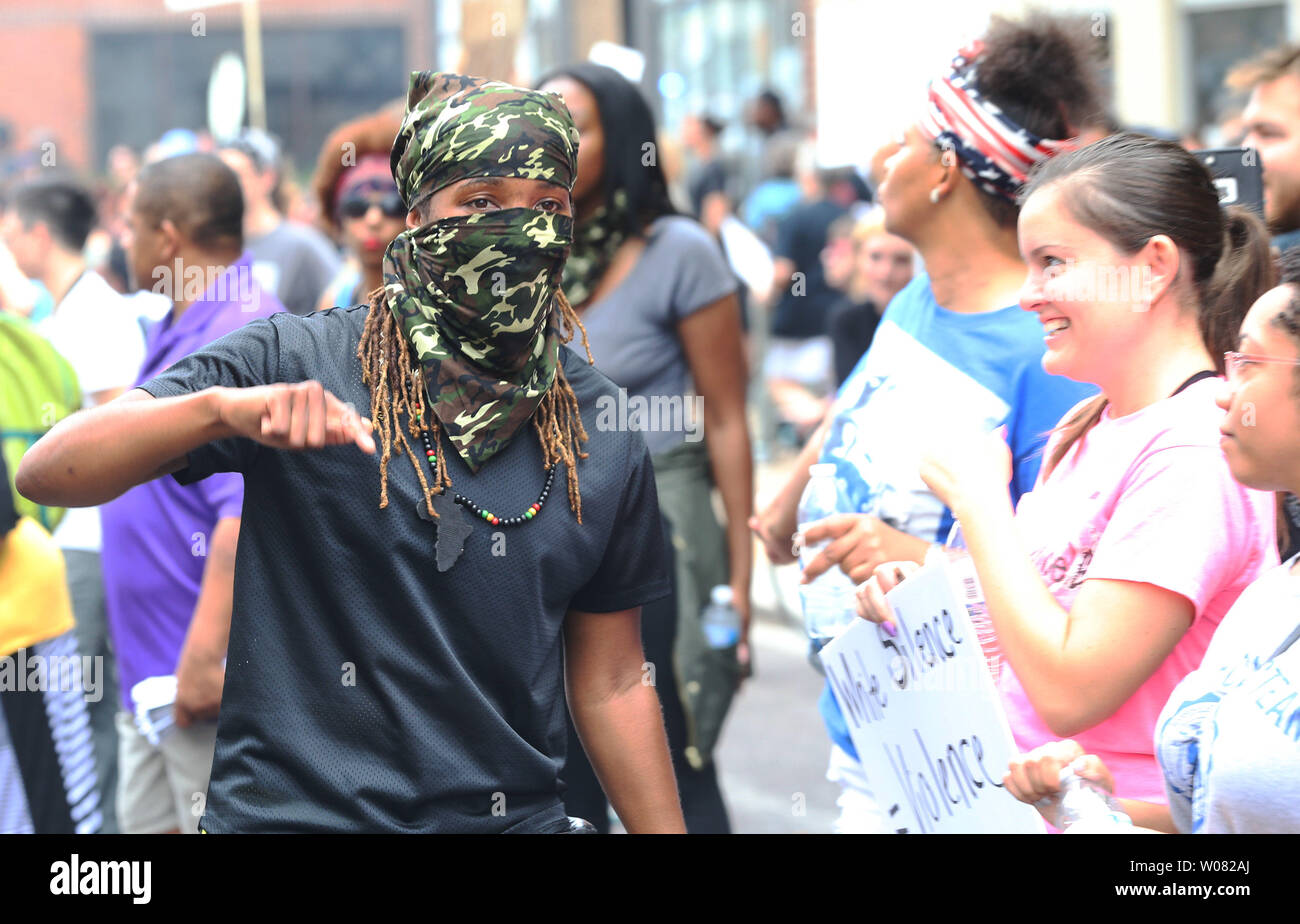 A masked protestor amuses the crowd during a peaceful protest outside of St. Louis Metropolitian Police Headquarters in St. Louis on September 17, 2017. A non-guilty verdict of a former white St. Louis policeman in the 2011 shooting of a black man in St. Louis has resulted in two nights of peaceful marching eventually turning violent. Jason Stockley was acquitted of first degree murder charges in the fatal shooting of Anthony Lamar Smith on Dec. 11, 2011 following a high-speed chase. Police have made nearly 50 arrests while a score of businesses have suffered broken windows.   Photo by Bill Gr Stock Photo