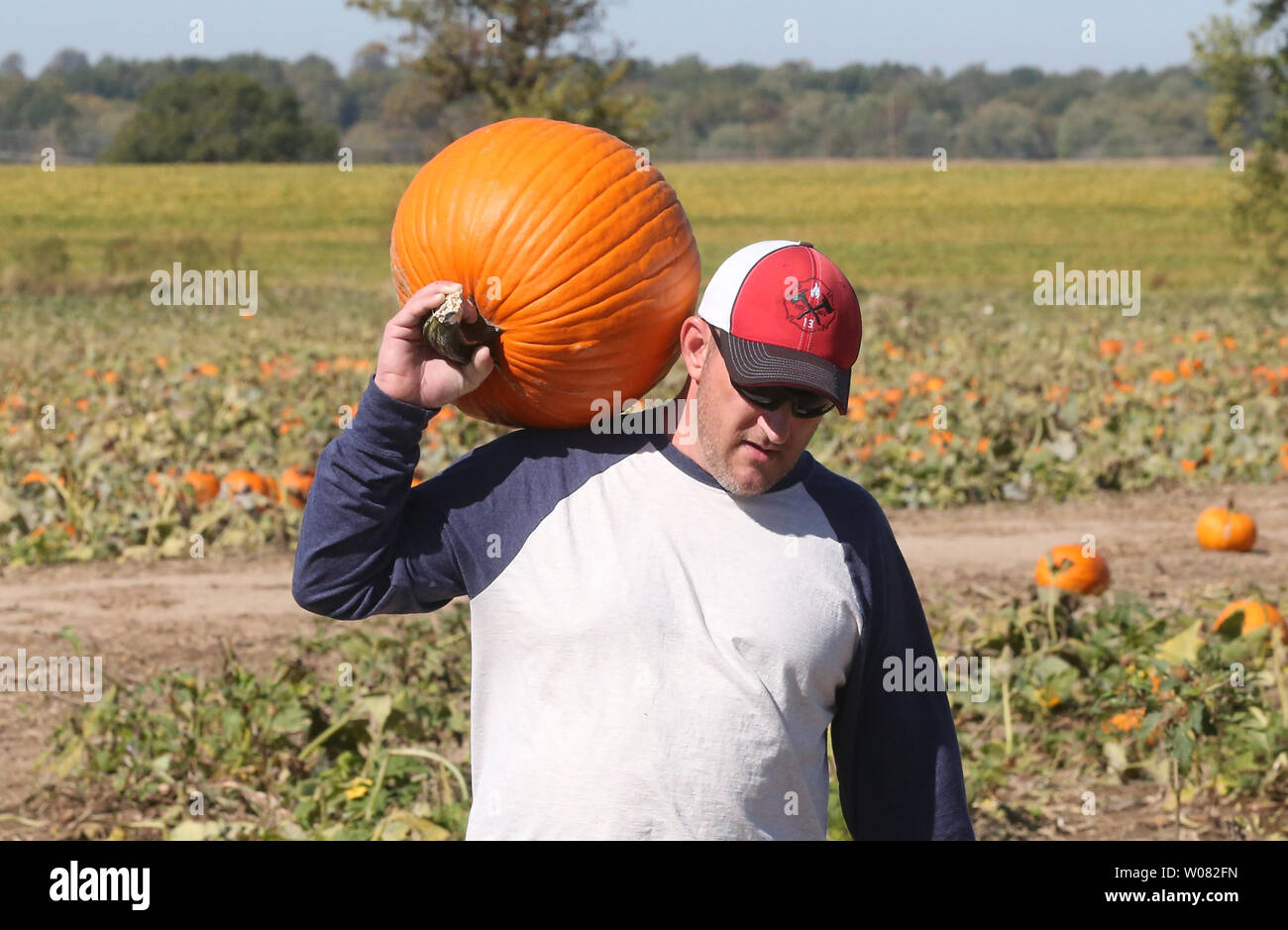 David Peters of Desoto, Missouri uses his shoulder to carry his