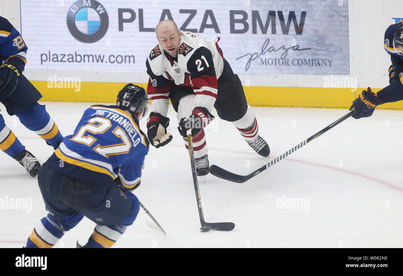 Arizona Coyotes Derek Stepan pushes the puck away from the St. Louis Blues after losing his helmet in the third period at the Scottrade Center in St. Louis on November 9, 2017.   Photo by Bill Greenblatt/UPI Stock Photo