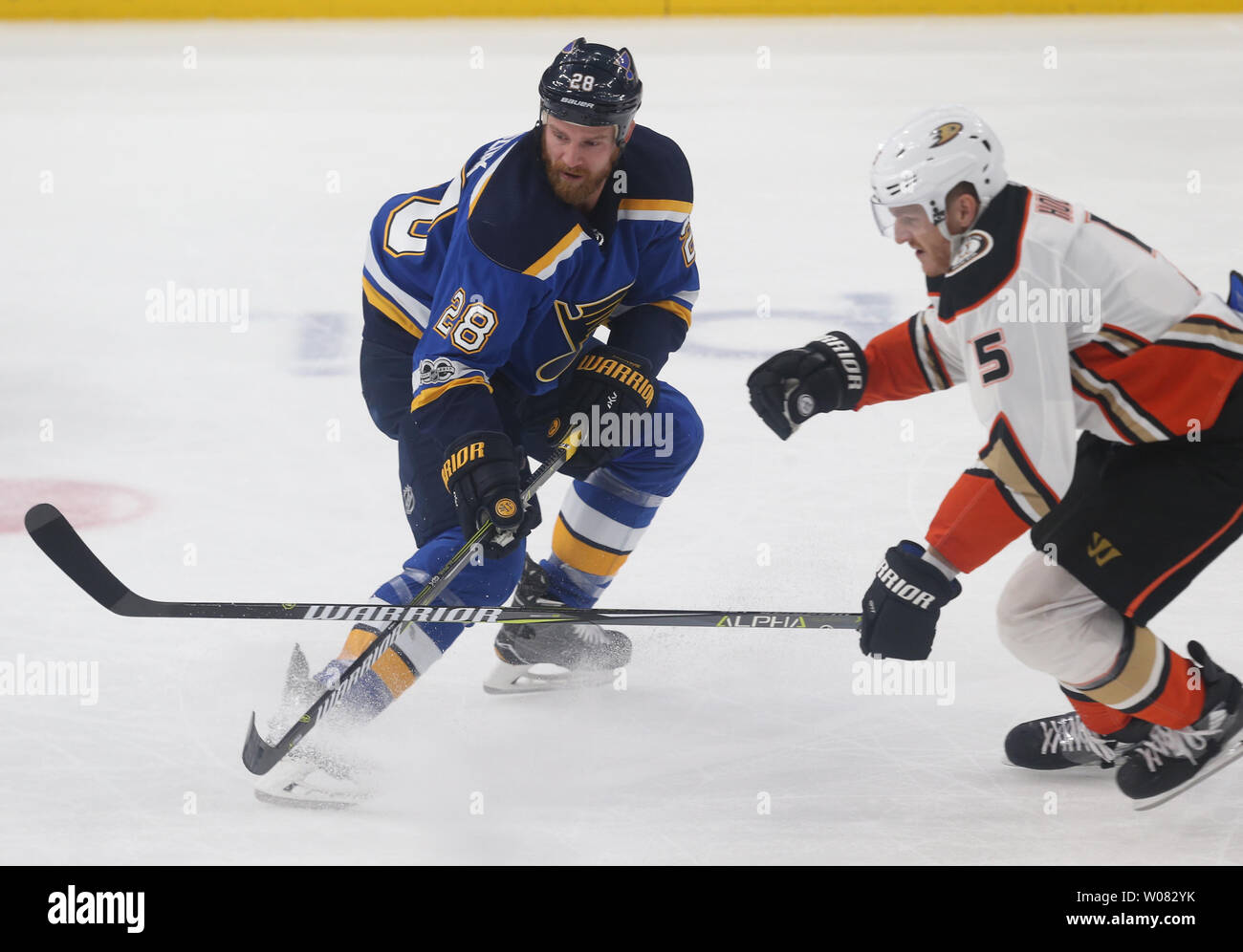 St. Louis Blues Kyle Brodziak and Anaheim Ducks Korbinian Holzer battle for the puck in the first period at the Scottrade Center in St. Louis on November 29, 2017. Photo by Bill Greenblatt/UPI Stock Photo