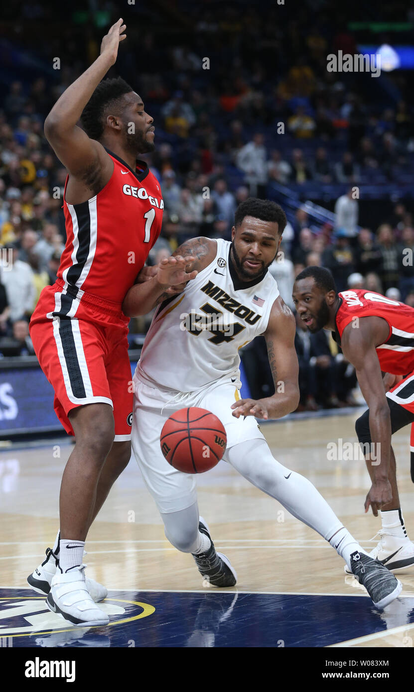 Missouri's Kevin Puryear loses the baketball trying to get around Georgia's Yanta Maten in the first half of their the SEC Tourament game at the Scottrade Center in St. Louis on March 8, 2018.  Photo by BIll Greenblatt/UPI Stock Photo