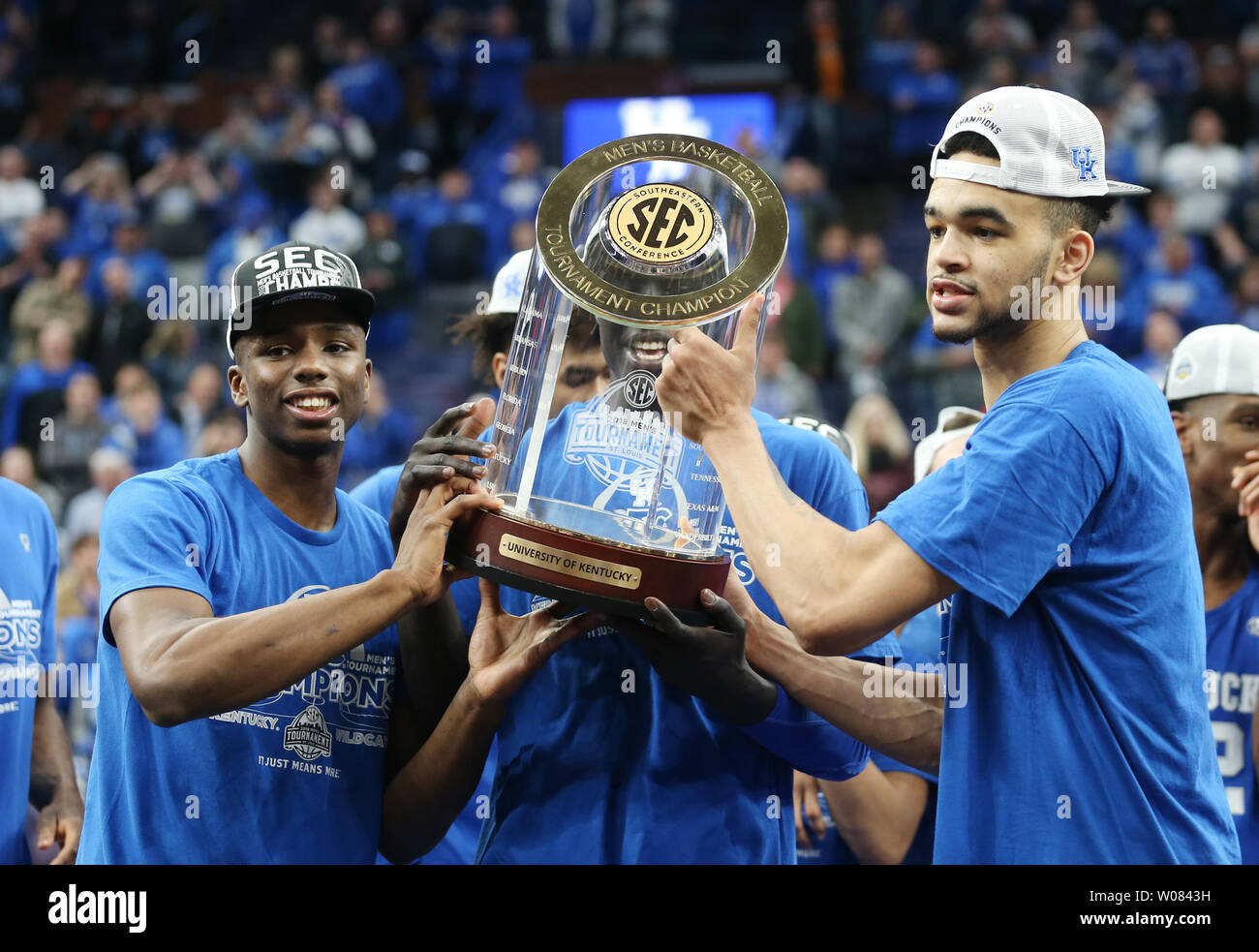 Kentucky players prepare to hoist their championship trophy after 