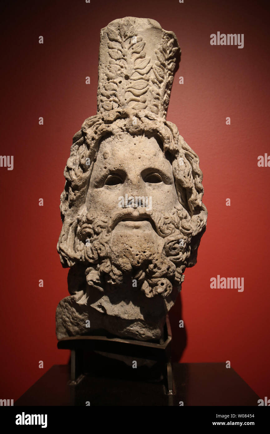 A head of Serapis with Kalathos made between 200-100 BC and recovered from the lost Mediterranean port city of Canopus sits on display at the Saint Louis Art Museum in St. Louis on March 22, 2018. In 1992, Franck Goddio, a pioneer of modern maritime archaeology discovered the ancient Great Port of Alexandria and in 2000, a team comprised of archaeologists, Egyptologists, historians, geologists, geophysicists and computer engineers discovered the submerged ancient city of Thonis-Heracleion and parts of the city of Canopus under 30 feet of water and four miles off today's Egyptian coast. The lar Stock Photo