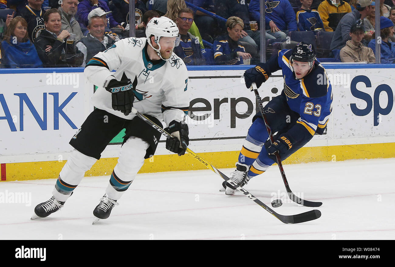 San Jose Sharks Paul Martin controls the bouncing puck in front of St. Louis Blues Dmitrij Jaskin of Russia in the first period at the Scottrade Center in St. Louis on March 27, 2018. Photo by Bill Greenblatt/UPI Stock Photo