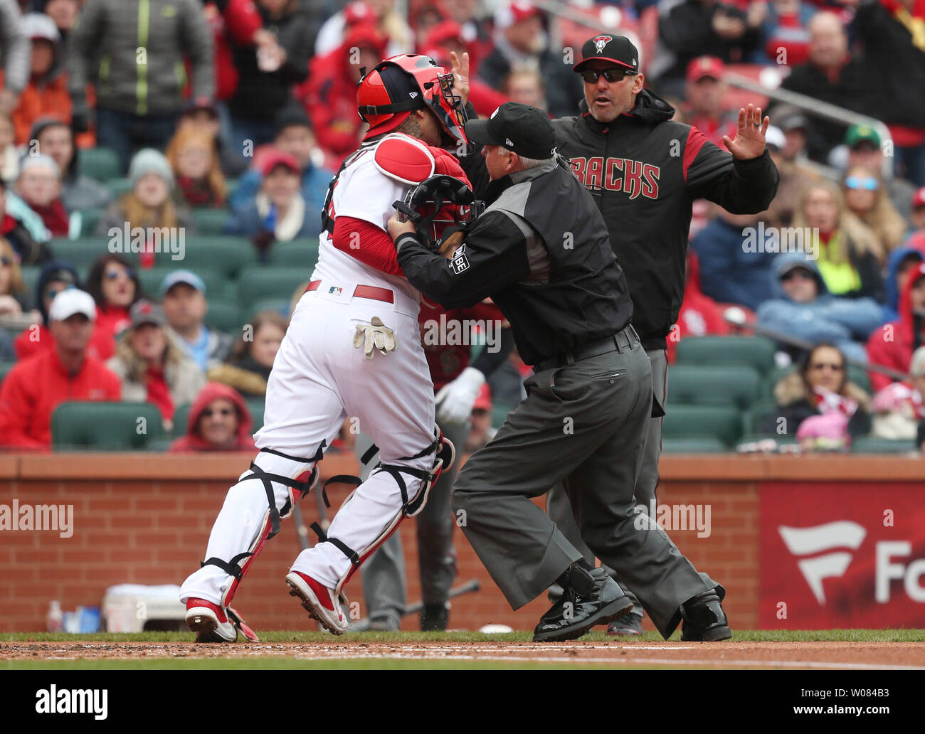 Umpires Laz Diaz and Mike Estabrook (L) comment to St. Louis Cardinals  manager Mike Matheny about the blue uniforms before a game against the  Milwaukee Brewers at Busch Stadium in St. Louis