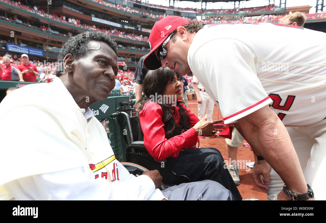 Baseball Hall of Famer and former St. Louis Cardinals great Lou Brock and  his wife Jackie talk to fans on the field before a game between the  Cardinals and the Boston Red