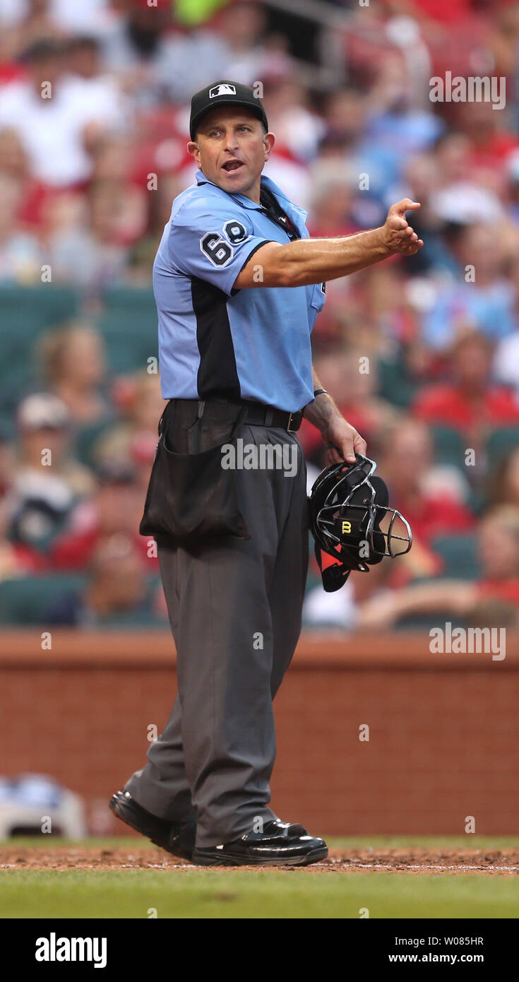 Home plate umpire Chris Guccione tries to explain to St. Louis Cardinals Dexter Fowler why he was tagged out at third base in the fifth inning against the Cincinnati Reds  at Busch Stadium in St. Louis on July 14, 2018. Photo by Bill Greenblatt/UPI Stock Photo