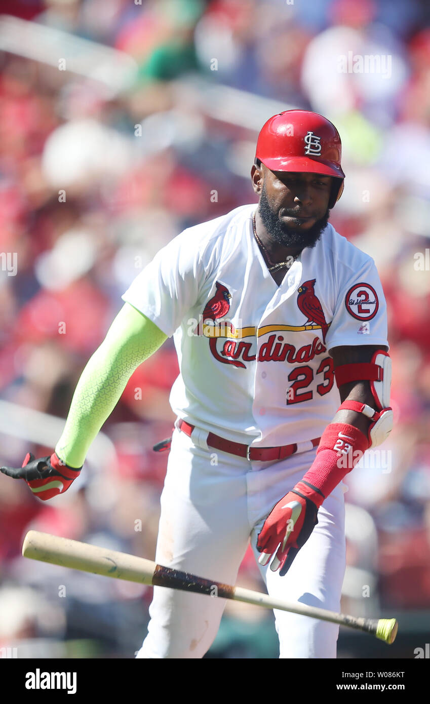 St. Louis Cardinals Marcell Ozuna throws down his bat after grounding