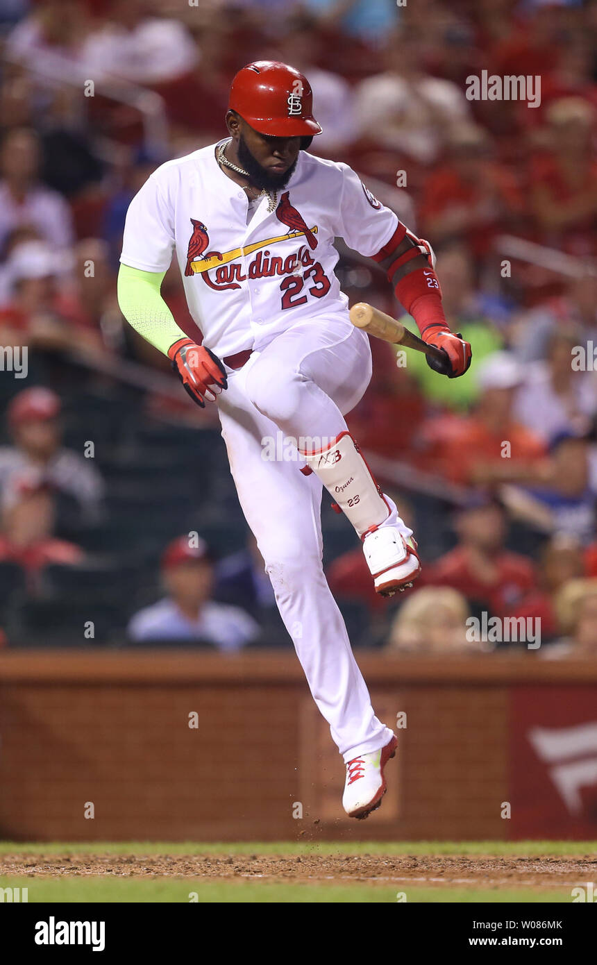 St. Louis Cardinals Marcell Ozuna tries to advoid a ball thrown by Los Angeles Dodgers pitcher Kenley Jansen in the ninth inning at Busch Stadium in St. Louis on September 13, 2018. Los Angeles defeated St. Louis 9-7.  Photo by Bill Greenblatt/UPI Stock Photo