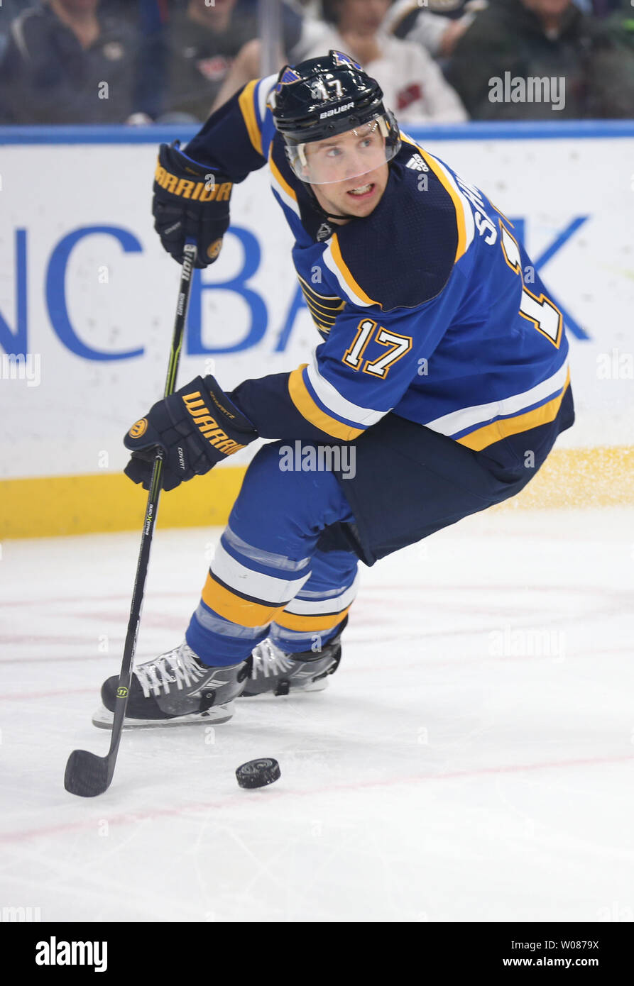 St. Louis Blues Jaden Schwartz fights off New Jersey Devils Travis Zajac  behind the net in the first period at the Enterprise Center in St. Louis on  February 12, 2019. Photo by