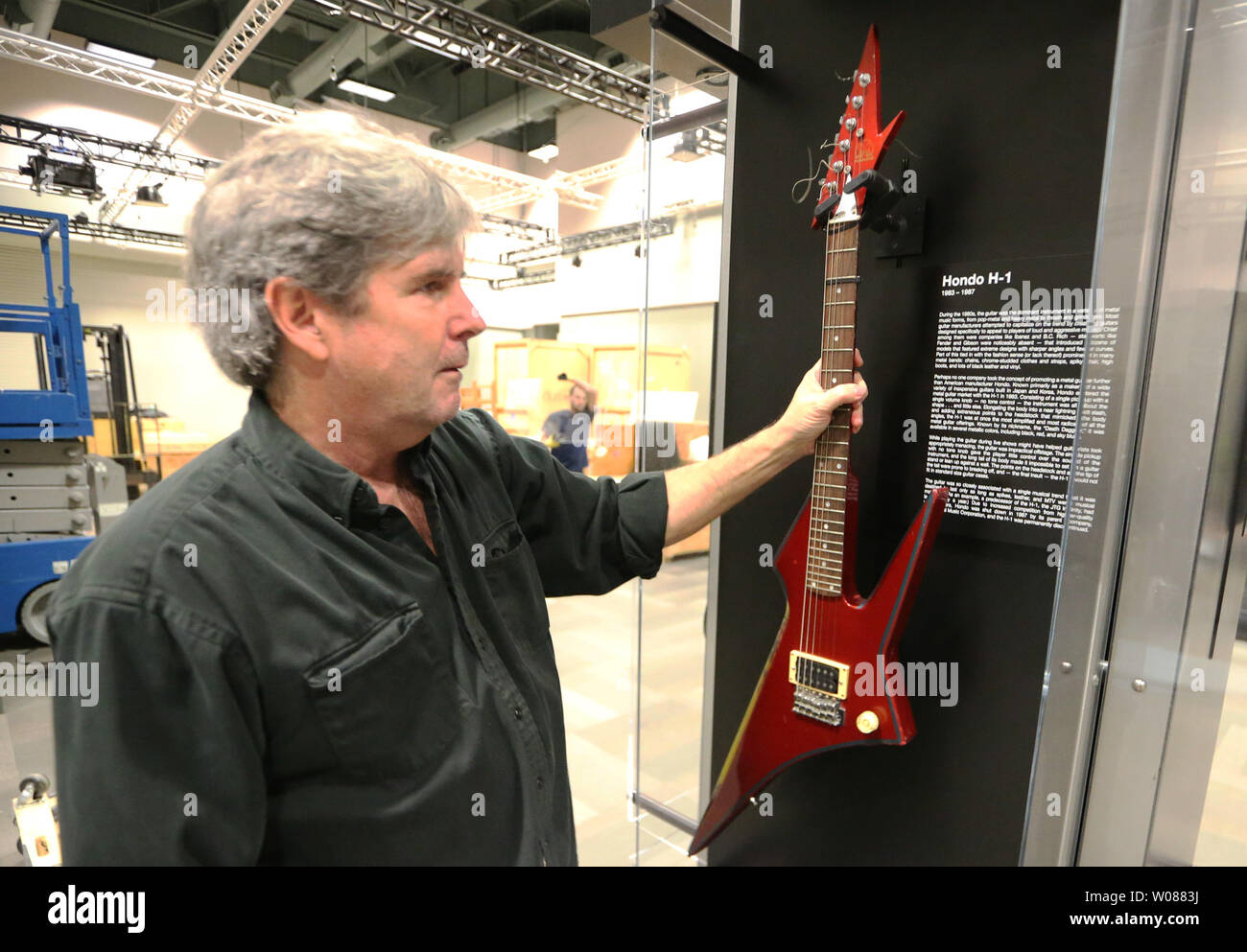 H.P. Newquist, Director of the National Guitar Museum, places a rare