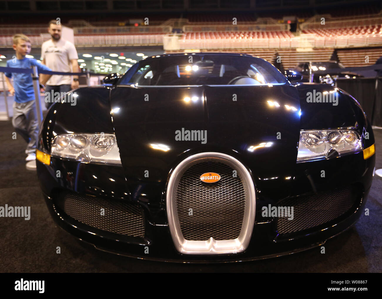 Visitors to the MIllion Dollar MIle stop to inspect the $1.4 million Bugatti Veyron EB 16.4, during Day 2 of the St. Louis Auto Show in St. Louis on January 25, 2019. Photo by BIll Greenblatt/UPI Stock Photo