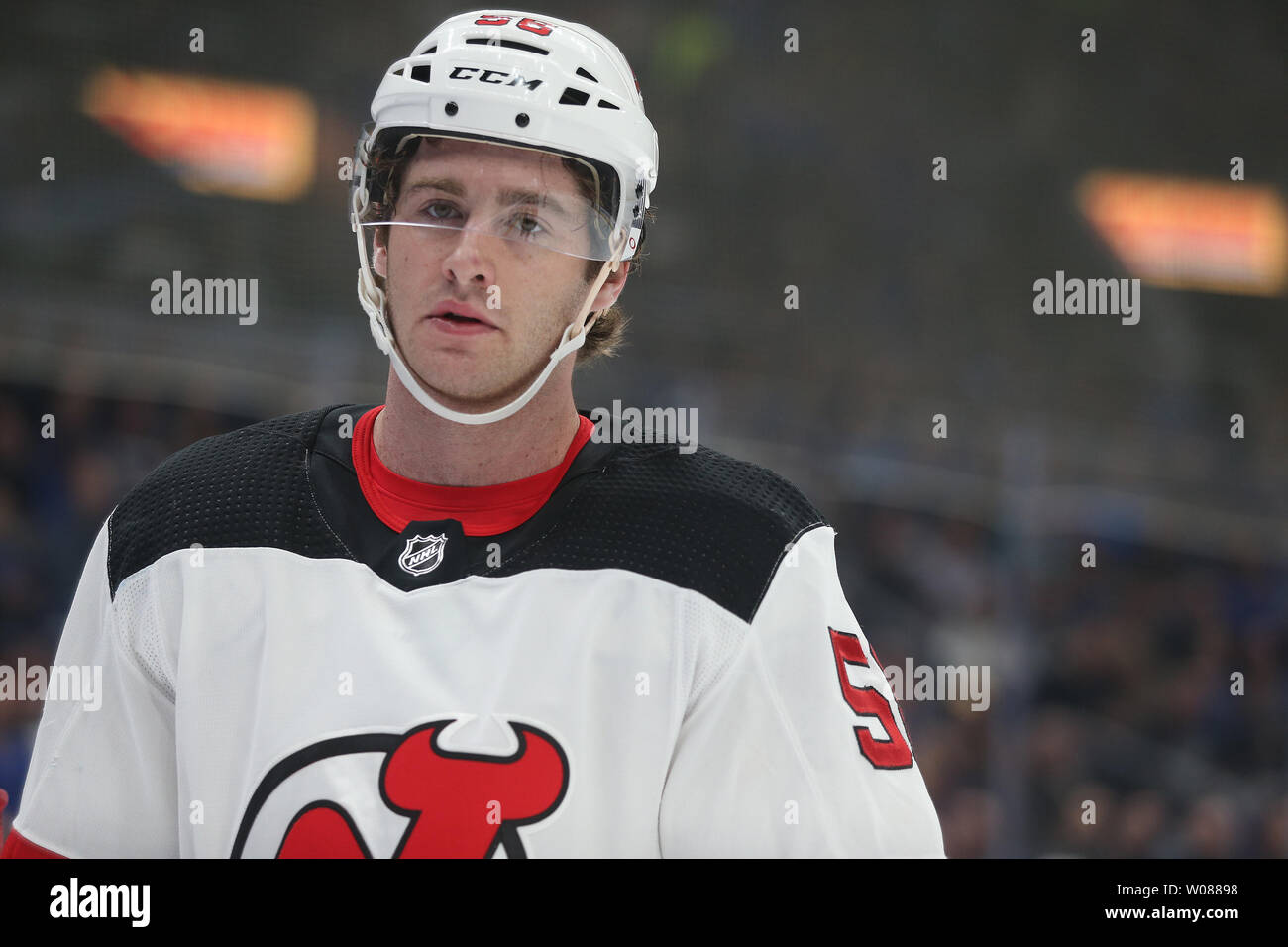 New Jersey Devils Kevin Rooney skates to his bench during a time out  against the St. Louis Blues in the first period at the Enterprise Center in  St. Louis on February 12,