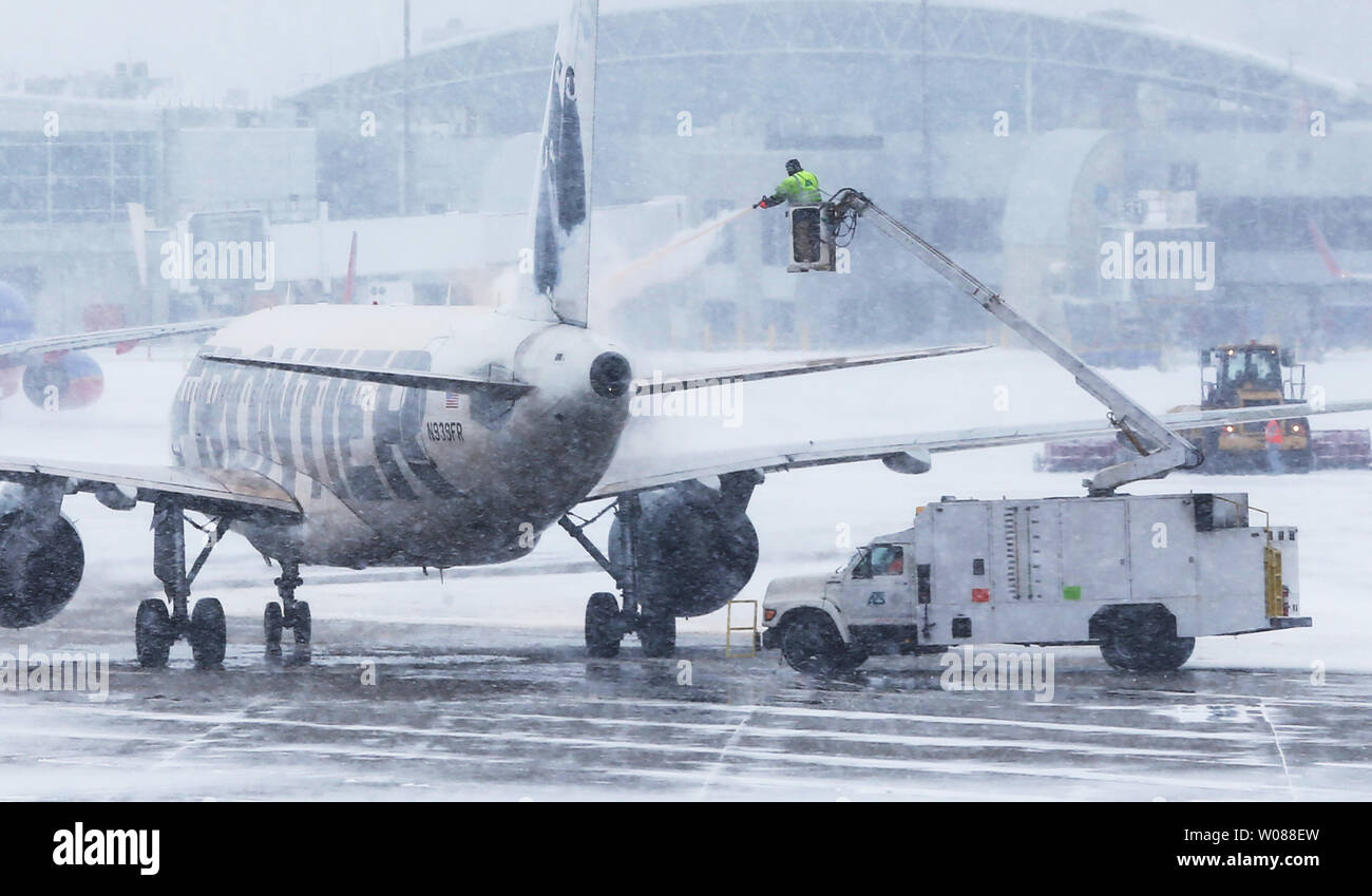 A Frontier jet sits on a taxiway, being de-iced during a heavy snow storm at St. Louis-Lambert International Airport in St. Louis on March 3, 2019. The morning storm dumped 2-3 inches on the area. Photo by Bill Greenblatt/UPI Stock Photo