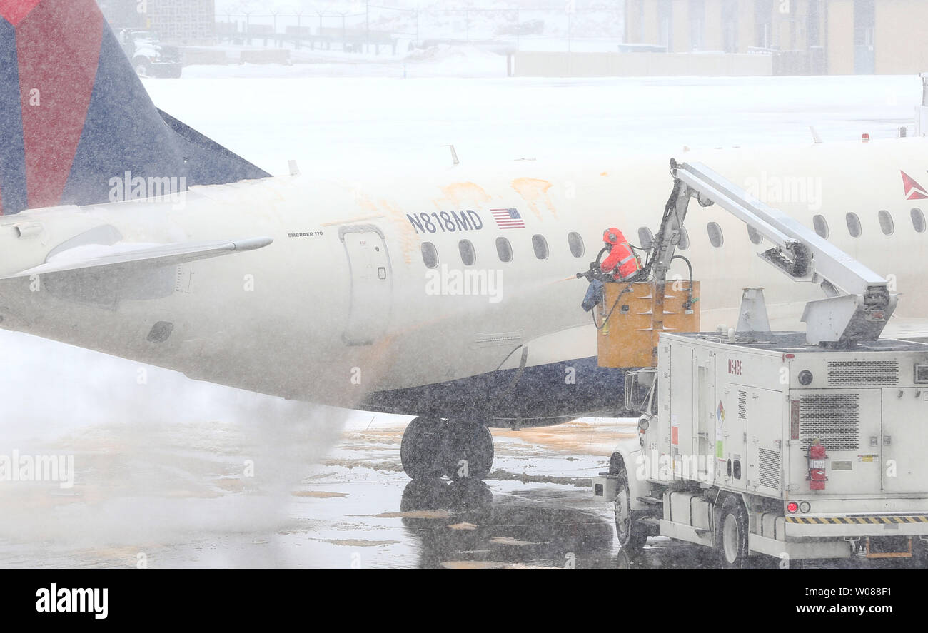 A plane is sprayed with de-icing fluid before leaving during a heavy snow storm at St. Louis-Lambert International Airport in St. Louis on March 3, 2019. The morning storm dumped 2-3 inches on the area. Photo by Bill Greenblatt/UPI Stock Photo