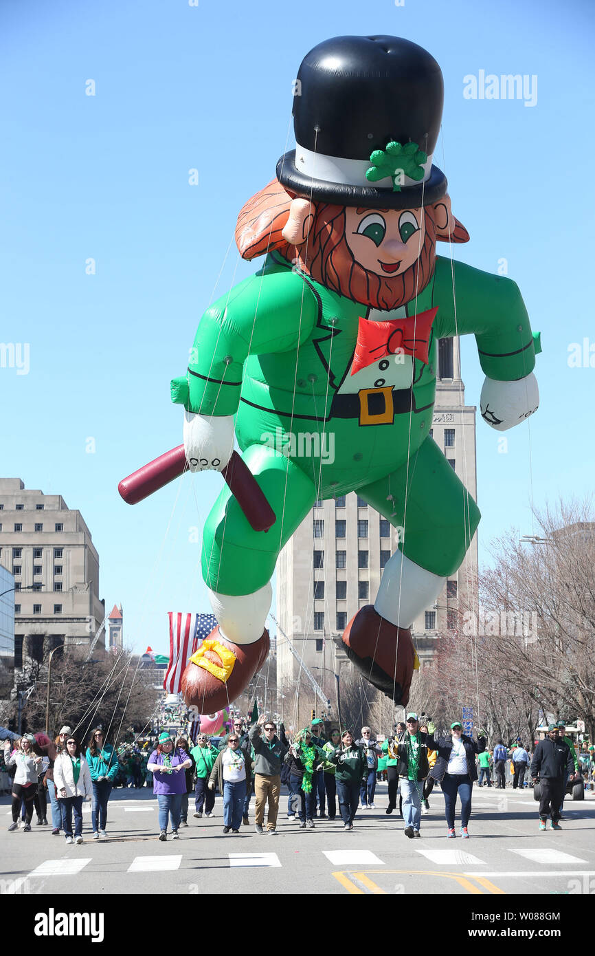 A leprechaun balloon makes its way down Market Street during the St. Patricks Day Parade in St