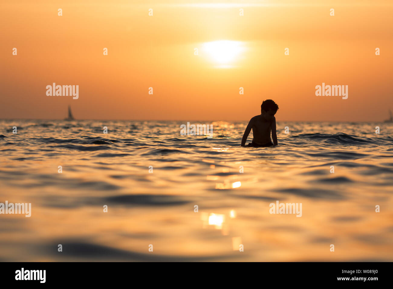silhouette of a surfer on sunset background in the sea or ocean Stock ...