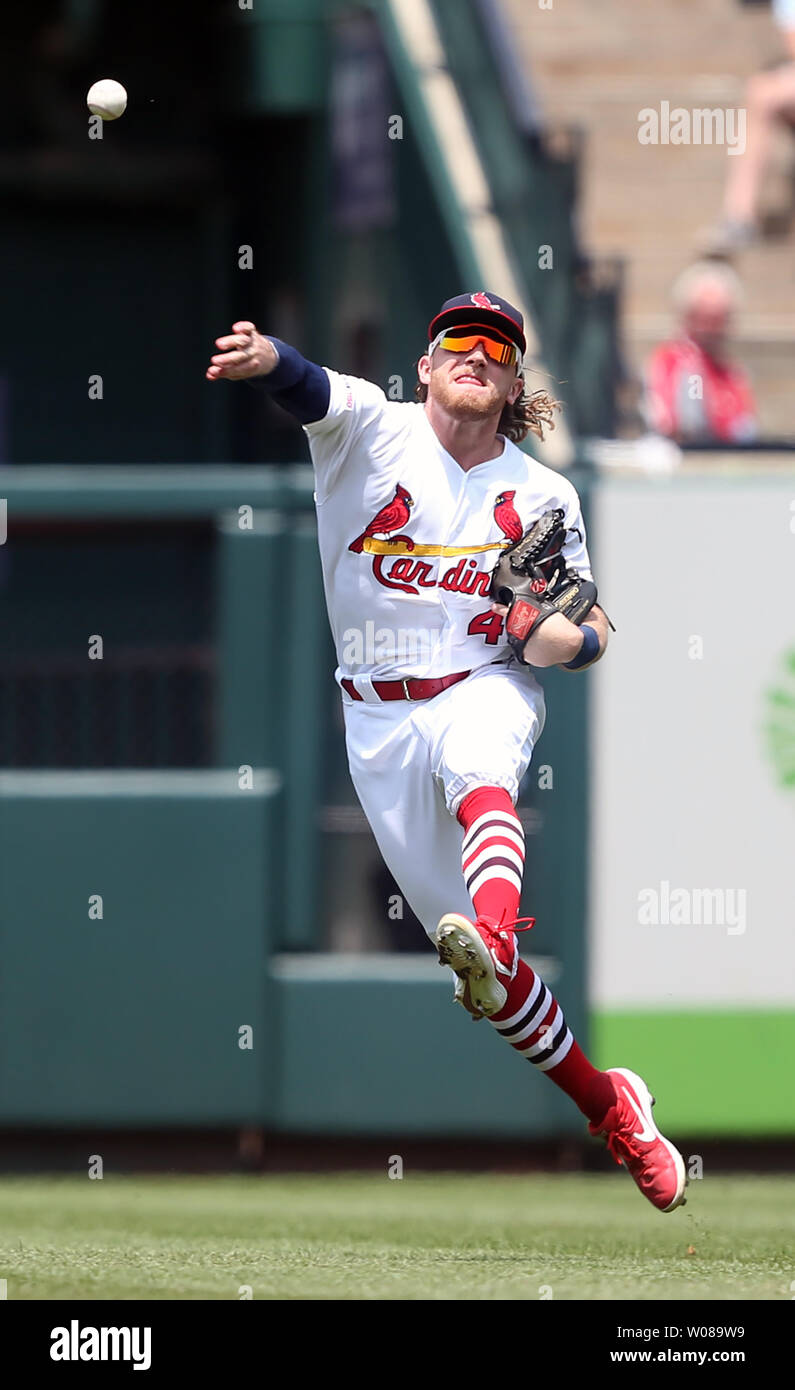 St. Louis Cardinals Harrison Bader makes a throw to first base in