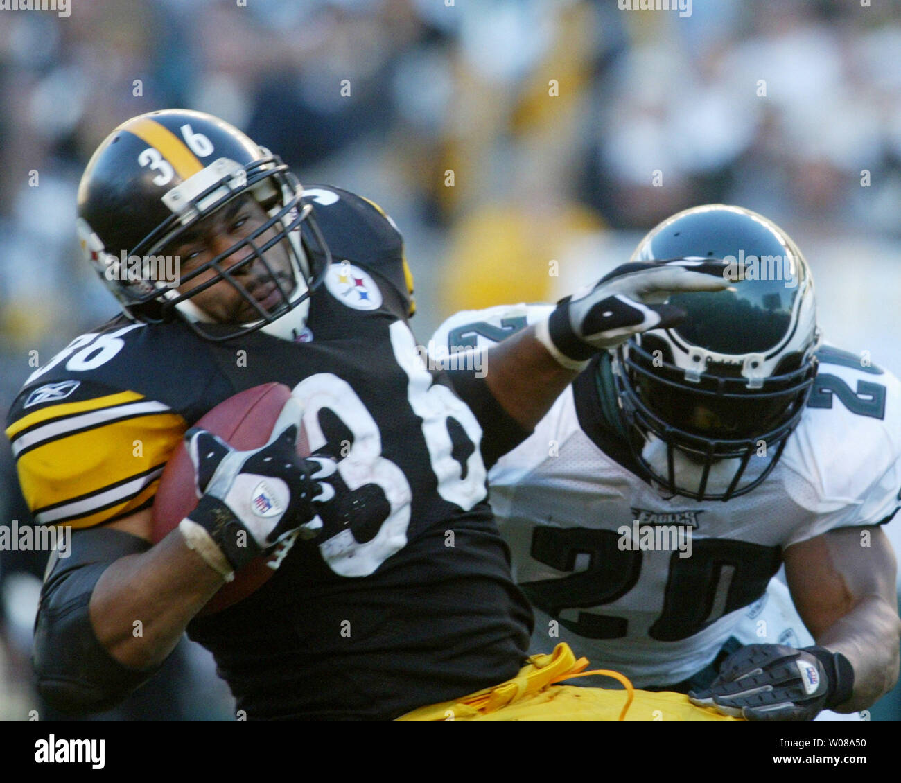 Philadelphia Eagles Brian Dawkins tries to being down Pittsburgh Steelers Jermoe Bettis during the fourth quarter   at Heinz Field in Pittsburgh, Pennsylvania, on November 7, 2004. The Steelers went on to defeat the Eagles 27 to 3, and end the Eagles winning streak.     (UPI Photo/Stephen M. Gross) Stock Photo