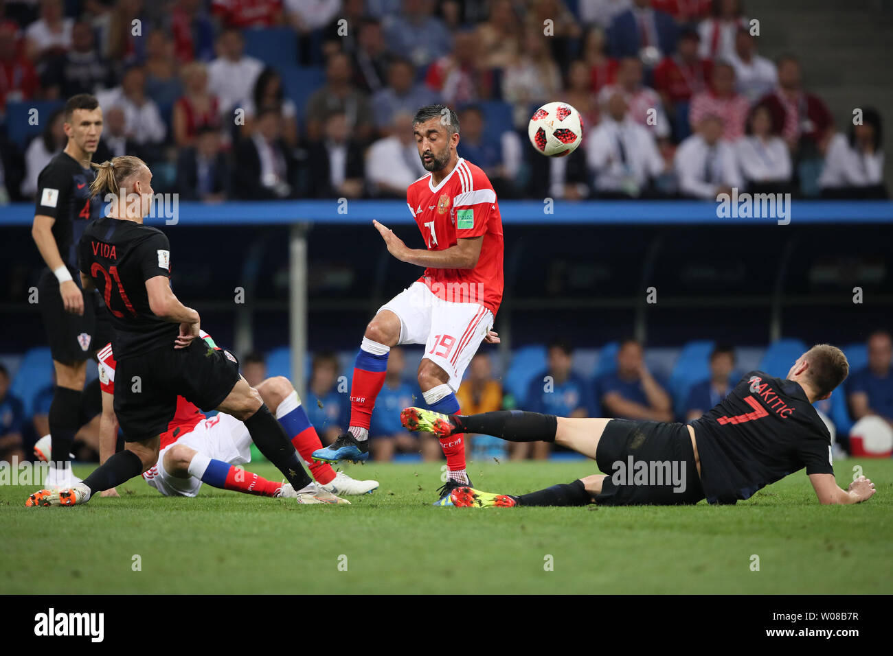 Aleksandr Samedov (C) of Russia is challenged by Ivan Rakitic (R) and Domagoj Vida of Croatia during the 2018 FIFA World Cup quarter-final match at Fisht Stadium in Sochi, Russia on July 7, 2018. Croatia beat Russia 4-3 on penalties to advance to the semi-finals. Photo by Chris Brunskill/UPI Stock Photo