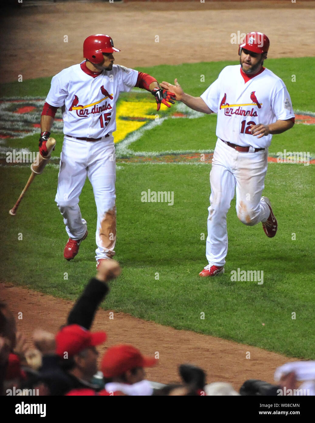 St. Louis Cardinals (L to R) Yadier Molina and Rafael Furcal along with (R  to L) Albert Pujols and Octavio Dotel pose for a photograph with Domician  singer Hector Acosta before a