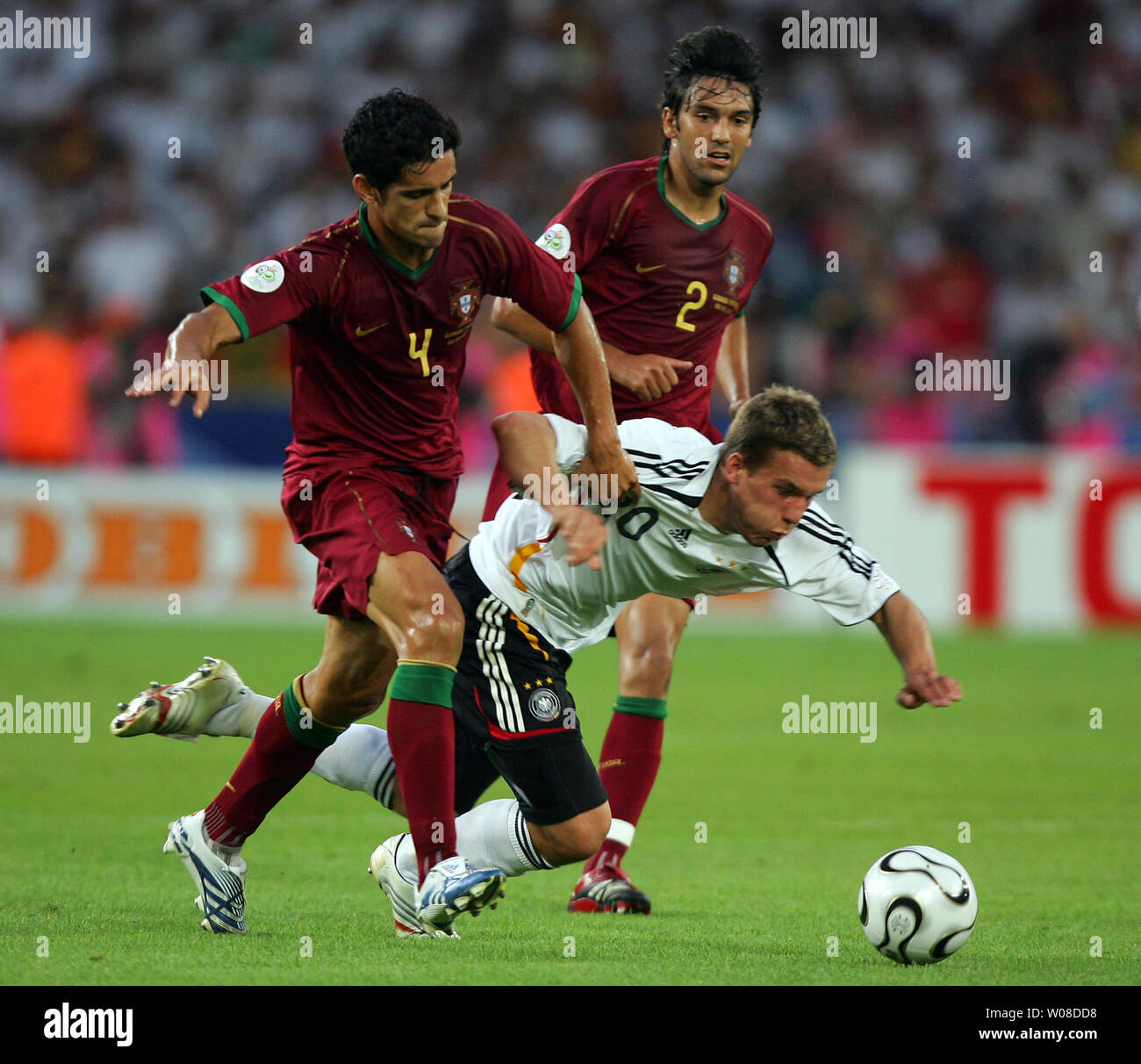 Germany's Lukas Podolski (C) is fouled by Portugal's Ricardo Costa during 2006 FIFA World Cup soccer in Stuttgart, Germany on July 8, 2006. Germany defeated Portugal 3-1 to capture third place in the World Cup.  (UPI Photo/Christian Brunskill) Stock Photo