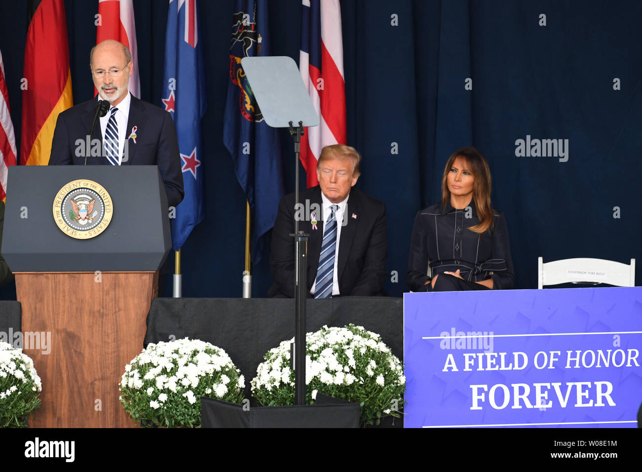 Pennsylvanis Governor Tom Wolf speaks at a ceremony marking the anniversary of 9/11 at the Flight 93 National Memorial in Shanksville, Pennsylvania on Tuesday, September 11, 2018. President Trump and the First Lady sit behind him.                    Photo by Pat Benic/UPI Stock Photo