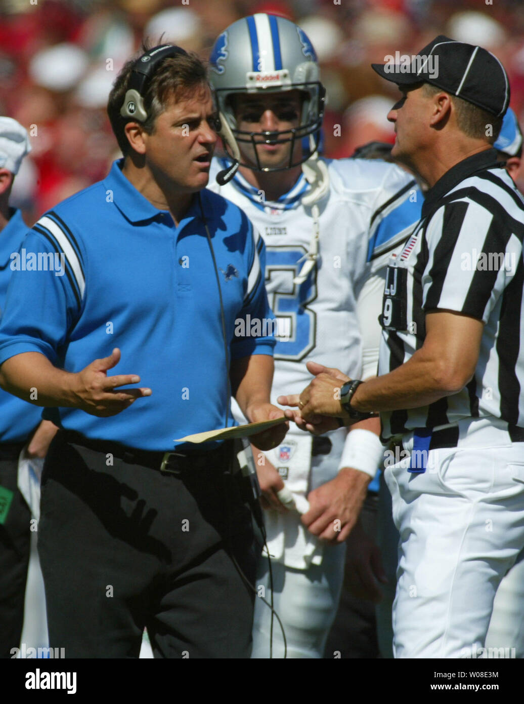The Detroit Lions coach Steve Mariucci discusses a call with line judge Mark Perlman as QB Joey Harrington looks on in San Francisco,  CA, October 5, 2003. The 49ers defeated the Lions 24-17.  (UPI/TERRY SCHMITT) Stock Photo