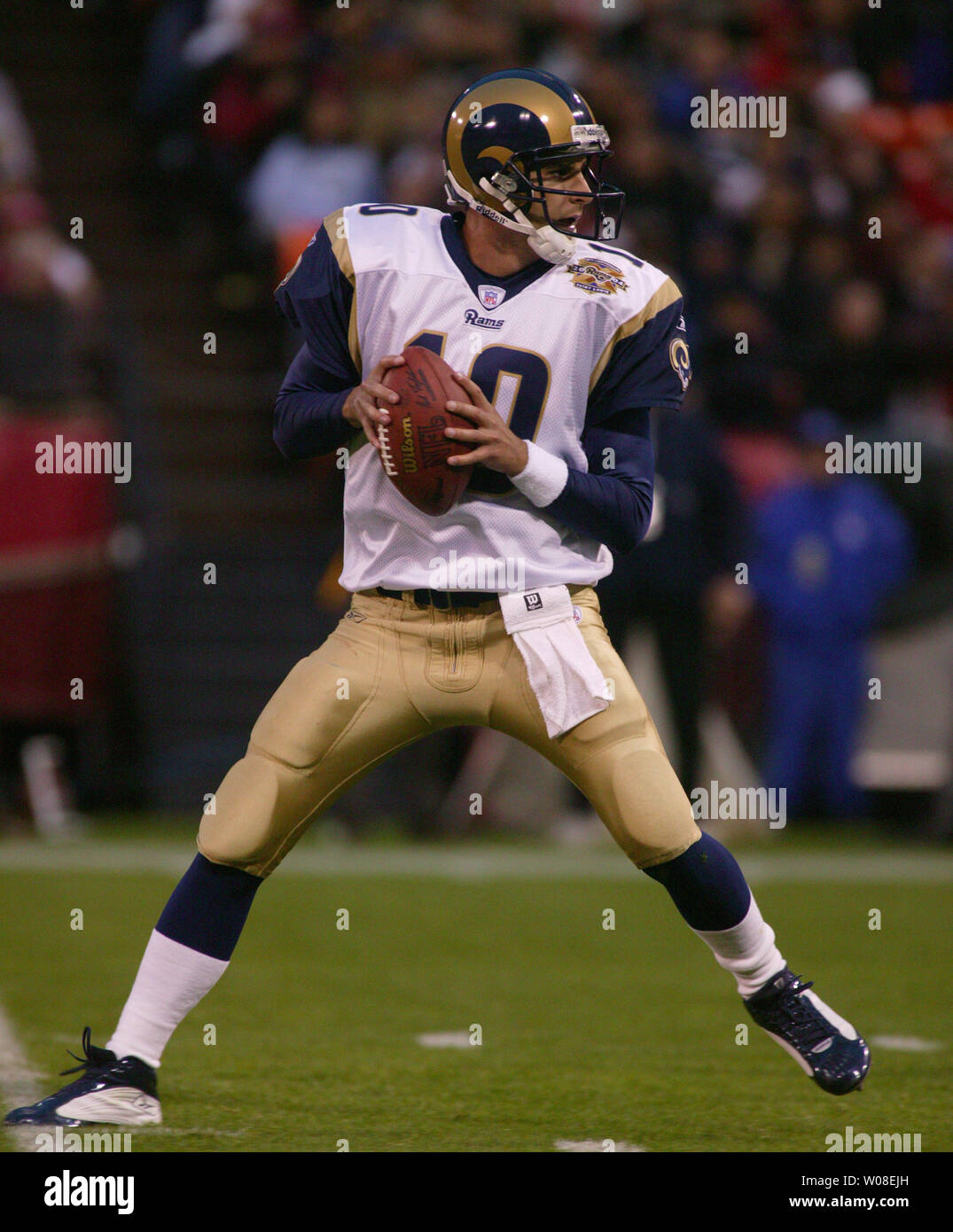 San Francisco Forty Niners quarterback Tim Rattay feels the pressure of St.  Louis Rams Damione Lewis, #92 and Leonard Littlel in the 2nd quarter of  their game at Monster Park in San