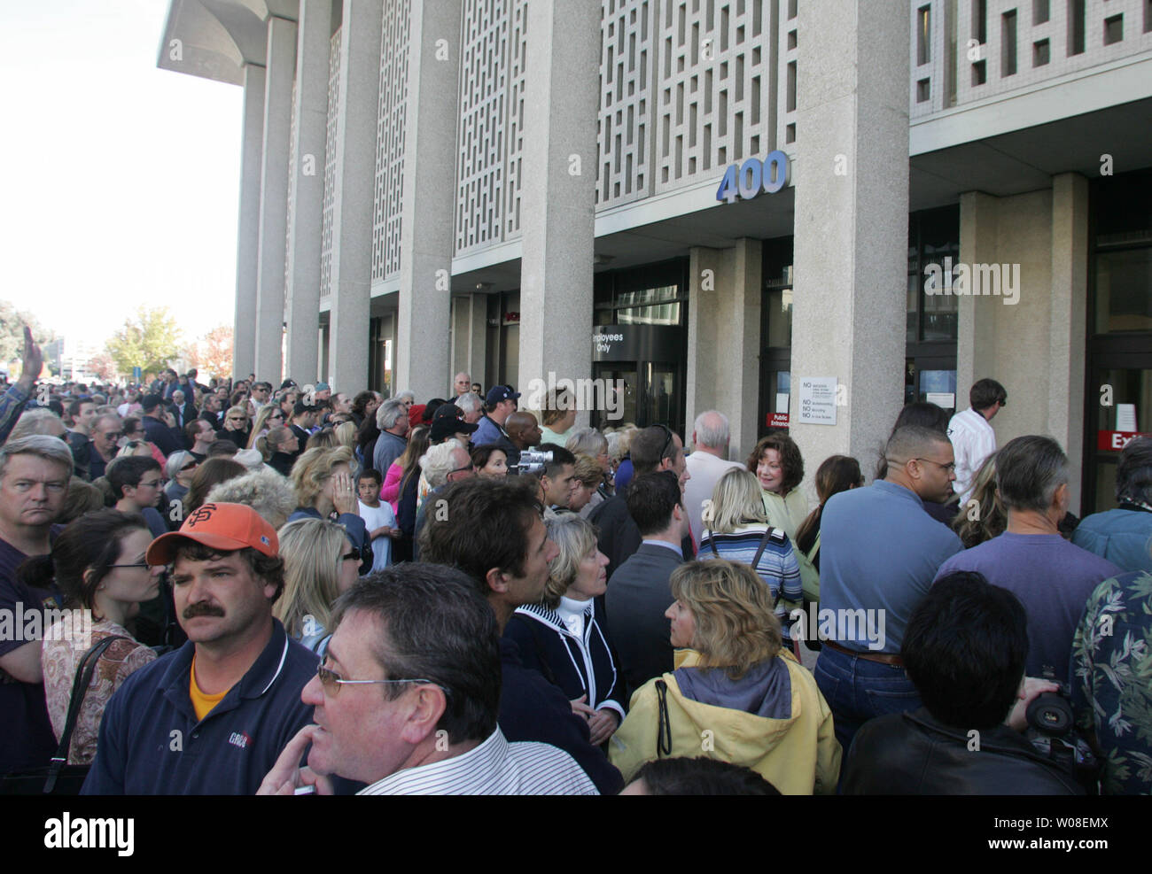 Spectators gather around outside the courthouse in Redwood City, California on November 12, 2004 hoping for a look at any of the participants in the Scott Peterson murder trial. Peterson was found guilty of murdering his wife Laci and unborn son.  (UPI Photo/Terry Schmitt) Stock Photo